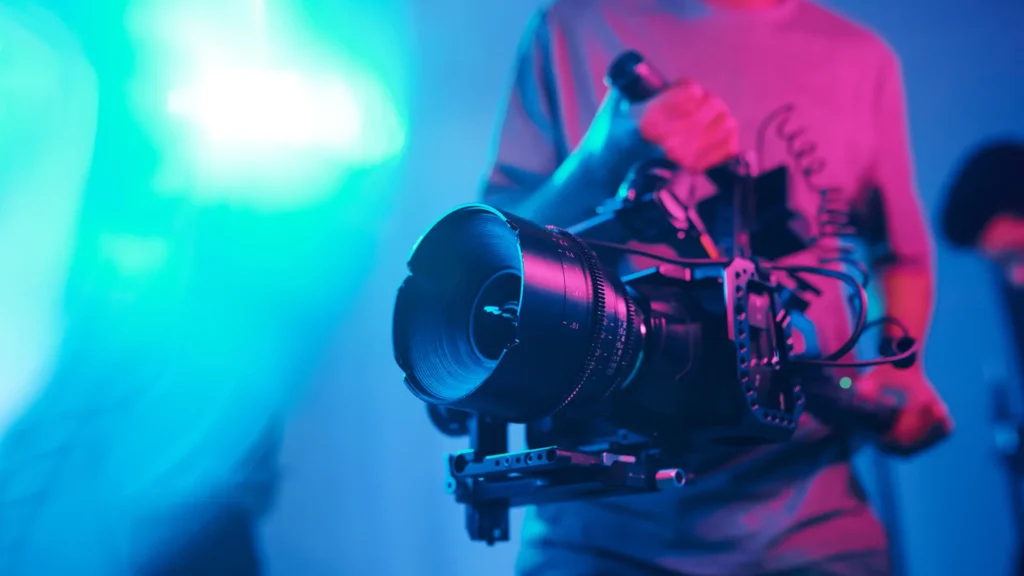 Cameraman filming with professional camera during video production shoot
